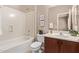 Bathroom featuring shower-tub combination, vanity, and framed mirror at 3044 E Trigger Way, Gilbert, AZ 85297