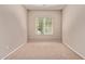 Neutral bedroom offering natural light from a window with blinds and plush carpeting at 3044 E Trigger Way, Gilbert, AZ 85297