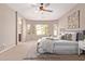 Bright and airy bedroom featuring a neutral color palette and a comfortable seating area with natural light at 3044 E Trigger Way, Gilbert, AZ 85297