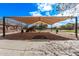 Community playground with shade structure, spring riders, climbing structure, and beautiful blue sky at 3044 E Trigger Way, Gilbert, AZ 85297