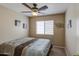 Bright bedroom with ceiling fan, window, and neutral color scheme creating a comfortable atmosphere at 30718 N Coral Bean Dr, San Tan Valley, AZ 85143