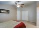 Spacious main bedroom with ceiling fan and double door closet for ample storage at 30718 N Coral Bean Dr, San Tan Valley, AZ 85143