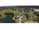 Aerial shot of park featuring athletic fields, playgrounds, lake, and walking paths for a vibrant community at 41 S Honeysuckle Ln, Gilbert, AZ 85296