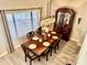 Traditional dining room with a vintage hutch, modern chandelier, and elegant table setting at 41 S Honeysuckle Ln, Gilbert, AZ 85296