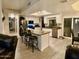 Bright and modern kitchen with an island, white cabinets, stainless appliances, and barstool seating at 41 S Honeysuckle Ln, Gilbert, AZ 85296