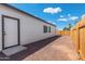 Side yard with gravel and a new wooden fence and easy access to home at 410 S 98Th Pl, Mesa, AZ 85208