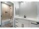 A serene bathroom featuring quartz countertops, a tiled shower, and modern fixtures for a luxurious experience at 410 S 98Th Pl, Mesa, AZ 85208