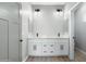 Bright bathroom with dual sinks, quartz countertops, and modern fixtures at 410 S 98Th Pl, Mesa, AZ 85208