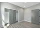 A cozy bedroom with a gray color scheme and sliding closet doors at 410 S 98Th Pl, Mesa, AZ 85208