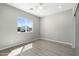 Serene bedroom featuring hardwood floors and a large window at 410 S 98Th Pl, Mesa, AZ 85208