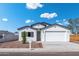 Charming single-story home boasts a two-car garage and desert landscaping at 410 S 98Th Pl, Mesa, AZ 85208