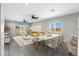 Bright living room featuring modern gray walls, wood flooring, and contemporary furnishings at 410 S 98Th Pl, Mesa, AZ 85208