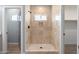 Tiled walk-in shower with a window and shampoo niche at 410 S 98Th Pl, Mesa, AZ 85208