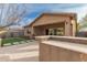 Backyard with artificial turf, outdoor kitchen, and covered patio at 412 W Lyle Ave, San Tan Valley, AZ 85140