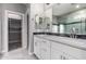 Bright bathroom features double sinks, quartz countertops, and a large mirror at 412 W Lyle Ave, San Tan Valley, AZ 85140