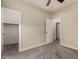 Carpeted bedroom with ensuite bathroom and walk-in closet for storage at 412 W Lyle Ave, San Tan Valley, AZ 85140