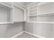 Walk-in closet with plenty of shelving and hanging storage for optimal organization at 412 W Lyle Ave, San Tan Valley, AZ 85140