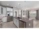 This stylish kitchen features an island with sink, stainless steel appliances, and a walk in pantry at 412 W Lyle Ave, San Tan Valley, AZ 85140