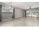 Bright living area features tile flooring, backyard view through large window and sliding door access at 412 W Lyle Ave, San Tan Valley, AZ 85140