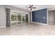 Spacious living room with tile floors, sliding glass doors, and lots of natural light at 412 W Lyle Ave, San Tan Valley, AZ 85140