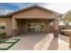 Covered patio with ceiling fan and tile flooring overlooks spacious backyard at 412 W Lyle Ave, San Tan Valley, AZ 85140