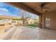 Covered patio featuring a water feature, artificial grass accents and beautiful pavers at 412 W Lyle Ave, San Tan Valley, AZ 85140