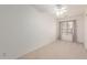 Neutral bedroom features a ceiling fan and bright natural light at 453 N Alder Ct, Gilbert, AZ 85233