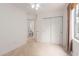 Neutral bedroom features a window, closet and attached bathroom entrance at 453 N Alder Ct, Gilbert, AZ 85233