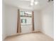 Neutral bedroom with a window and view of a two-story home at 453 N Alder Ct, Gilbert, AZ 85233