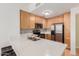 Updated kitchen with stainless steel appliances, mosaic tile backsplash, and breakfast bar seating at 453 N Alder Ct, Gilbert, AZ 85233