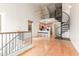 Open concept living space with a modern spiral staircase leading to a cozy loft at 453 N Alder Ct, Gilbert, AZ 85233