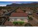 Stunning aerial view of a home with a covered patio and landscaped backyard at 4846 S Rimrock Loop, Gold Canyon, AZ 85118