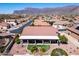 Stunning aerial view features desert landscaping and backyard patio with mountain views at 4846 S Rimrock Loop, Gold Canyon, AZ 85118