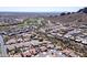 Expansive aerial view of a desert community showcasing lush green golf courses, mountain views, and tile roofed homes at 4846 S Rimrock Loop, Gold Canyon, AZ 85118