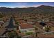 Aerial view of home with mountain views, landscaping, and desert landscape in a suburban neighborhood at 4846 S Rimrock Loop, Gold Canyon, AZ 85118