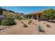 Spacious backyard with desert landscaping, artificial turf, covered patio and mountain views at 4846 S Rimrock Loop, Gold Canyon, AZ 85118