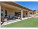 Covered patio with outdoor seating and a ceiling fan offering a comfortable and relaxing outdoor living space at 4846 S Rimrock Loop, Gold Canyon, AZ 85118