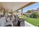 Stylish covered patio featuring a fire pit, comfortable seating, and picturesque landscaping at 4846 S Rimrock Loop, Gold Canyon, AZ 85118