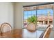 Cozy dining area featuring a wooden table and chairs with a scenic view of the outdoors at 4846 S Rimrock Loop, Gold Canyon, AZ 85118