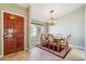 Elegant dining room featuring a chandelier and a decorative area rug at 4846 S Rimrock Loop, Gold Canyon, AZ 85118