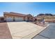 Inviting single-Gathering home featuring desert landscaping, three-car garage, and mountain views at 4846 S Rimrock Loop, Gold Canyon, AZ 85118