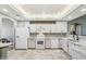 Bright kitchen with white appliances, countertops, and ample cabinet space, creating a clean aesthetic at 4846 S Rimrock Loop, Gold Canyon, AZ 85118