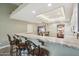 Kitchen bar seating with modern cabinets and a seamless flow to the dining room at 4846 S Rimrock Loop, Gold Canyon, AZ 85118