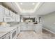 Bright kitchen featuring white cabinets, marble countertops, and modern appliances at 4846 S Rimrock Loop, Gold Canyon, AZ 85118