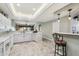 Open kitchen featuring a breakfast bar, marble counters, and modern lighting fixtures at 4846 S Rimrock Loop, Gold Canyon, AZ 85118