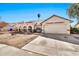 Charming single-story home with a two-car garage, arched entryway, and a well-maintained front yard at 4913 E Halifax St, Mesa, AZ 85205