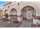 Charming front porch with arched openings and plants for outdoor living at 4913 E Halifax St, Mesa, AZ 85205