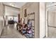 Hallway featuring neutral walls, tiled floors and storage solutions at 4913 E Halifax St, Mesa, AZ 85205