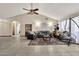 Bright living room with vaulted ceilings, neutral tones, and comfortable seating arrangement at 4913 E Halifax St, Mesa, AZ 85205