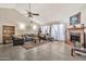 Inviting living room with high ceilings, a cozy fireplace, and comfortable seating arrangement at 4913 E Halifax St, Mesa, AZ 85205